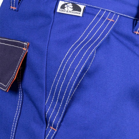 SPODNIE OCHRONNE DLA SPAWACZY SPECWELD TRUDNOPALNE, NIEBIESKO-GRANATOWO-POMARAŃCZOWE